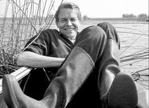 The Danish designer Viggo Boesen sitting in a boat.